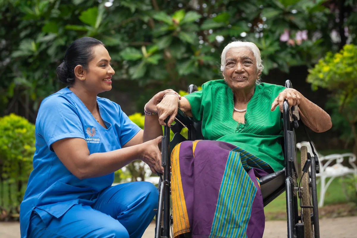 A Golden Hands caregiver with a resident