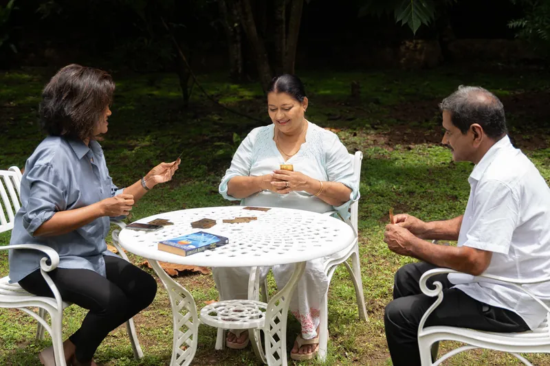 Residents enjoying a card game in the Golden Hands garden